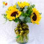 5 girasoles en jarron de vidrio